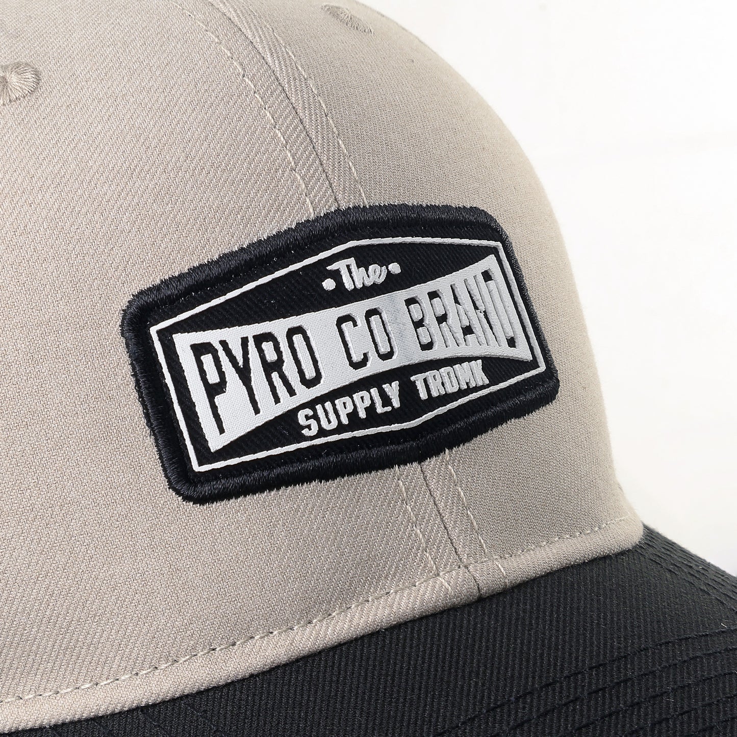 The Pyro Co Brand Patch Trucker Cap - Beige Vis Negro